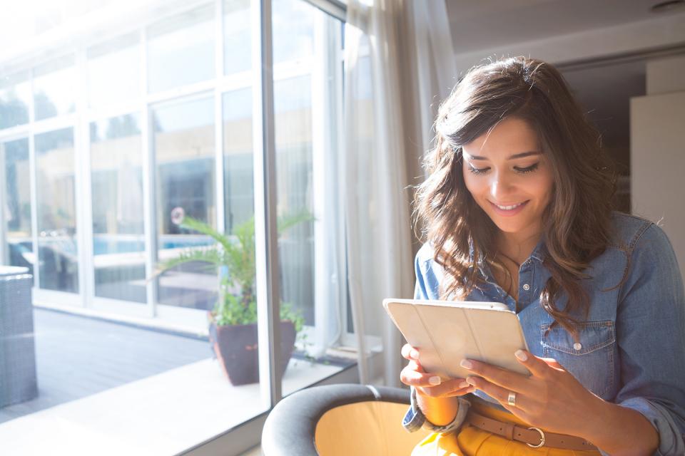 Co-parent reading message on tablet